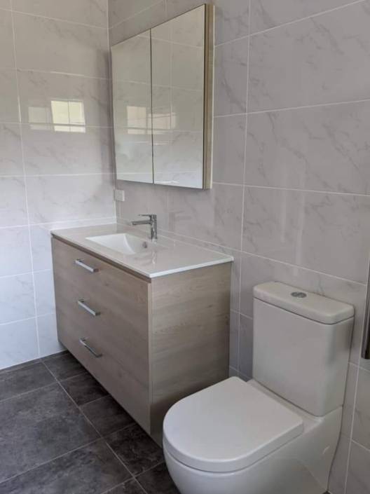 Bathroom featuring Cement 36DG Floor and Campania Carrara Walls Bathroom featuring Cement 36DG Floor and Campania Carrara Walls